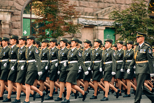 Kyiv, Ukraine - August 22, 2021: Rehearsal of military parade on occasion of 30 years Independence Day of Ukraine. Young female soldiers marching along Khreshchatyk street