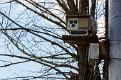 Speed radar camera detector mounted on the pole front closeup telephoto view