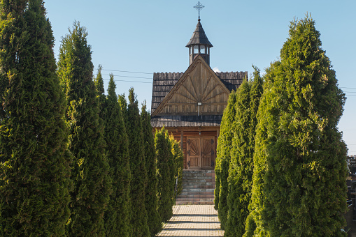 A small wooden cemetery church in Banska Wyzana in Podhale, Poland
