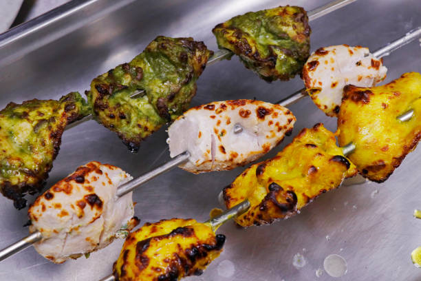 istock multi flavored marinated tandoori chicken tikka skewer, includes malai, hariyali and saffron kebab 1335980828