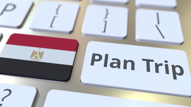PLAN TRIP text and flag of Egypt on the computer keyboard, travel related 3D animation