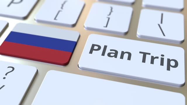 PLAN TRIP text and flag of Russia on computer keyboard