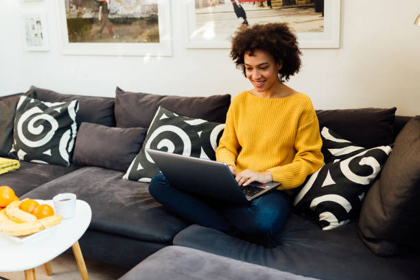 istock Young African American woman casually working from home 1335984835