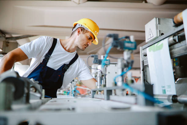 istock Man working on the industrial machinery for recycling plastic 1335986186