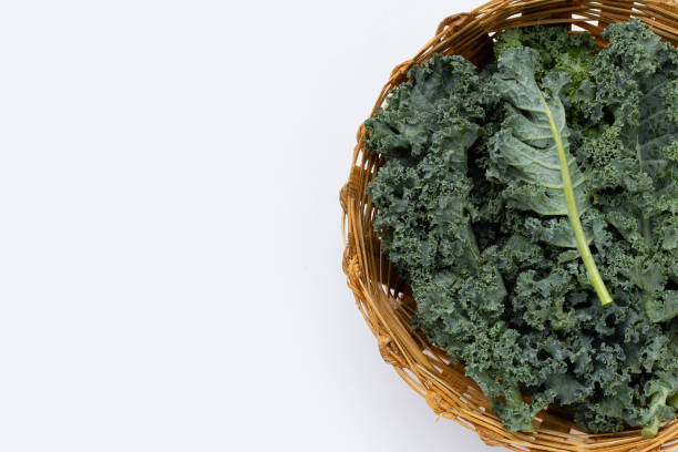 istock Kale leaves in bamboo basket on white background. 1335990853