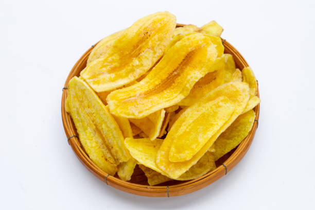istock Banana slice chips bamboo basket on white background 1335991079