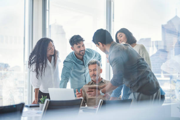 istock Diverse group of business people working and brainstorming. 1335991714