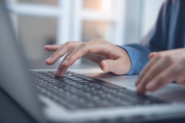 istock Business woman typing on laptop computer 1335991781