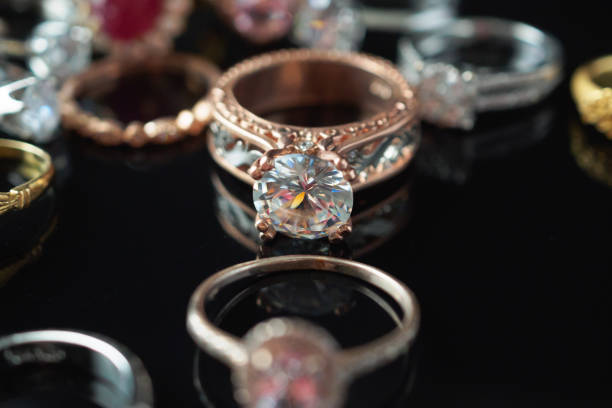 istock Beautiful diamond rings jewelry background 1335994211