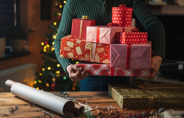 istock Man Holding Organic Christmas Presents. 1335994332