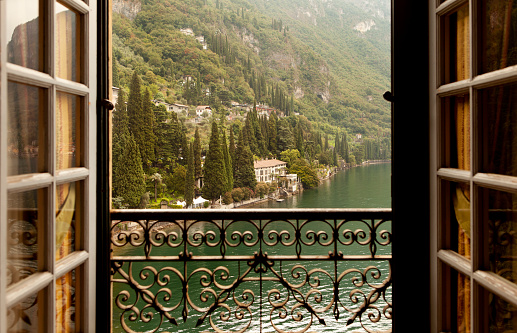 Doors opening to views of Lake Como in Italy.