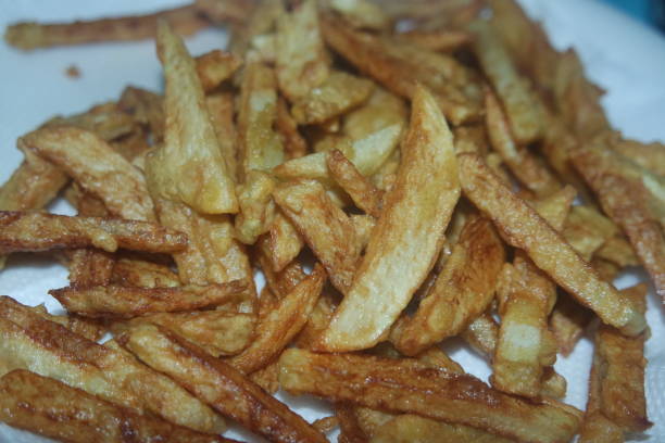 istock Potato fried or roasted slices on clean background with copy space for text 1335994795