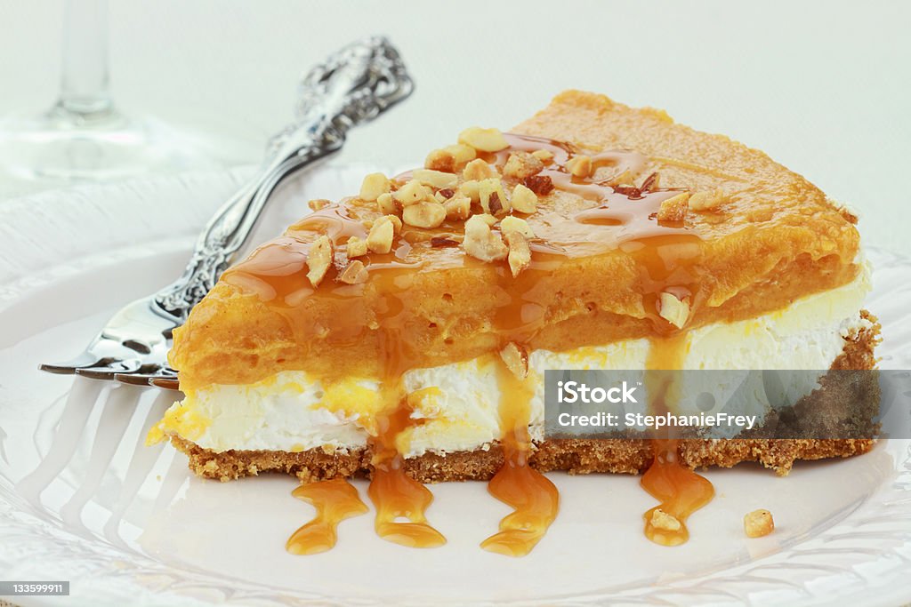 Double Layer No Bake Pumpkin Pie Slice of Double Layer No Bake Pumpkin Pie made with pumpkin, vanilla pudding,and cream cheese ready for Thanksgiving or Christmas dinner. Caramel Stock Photo