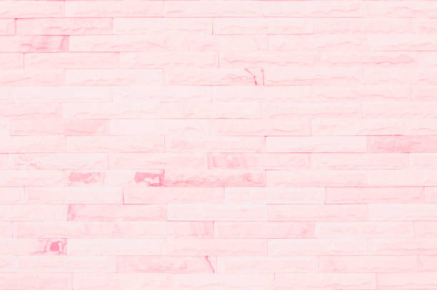 Empty Pink brick wall texture background in the bedroom at lovely. Brickwork stonework interior, rock old clean concrete grid uneven abstract weathered brick design, horizontal architecture wallpaper.