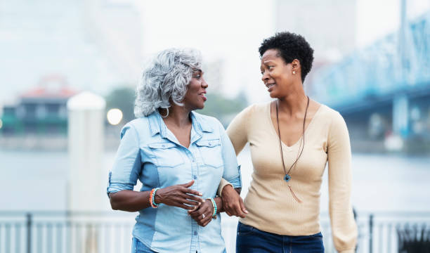 istock Woman looking a bit concerned talking with senior mother 1336010309