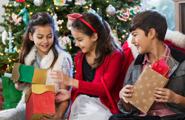 istock Children opening Christmas gifts 1336010428