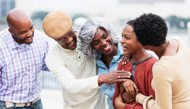 istock Multi-generation African-American family, looking at boy 1336010438