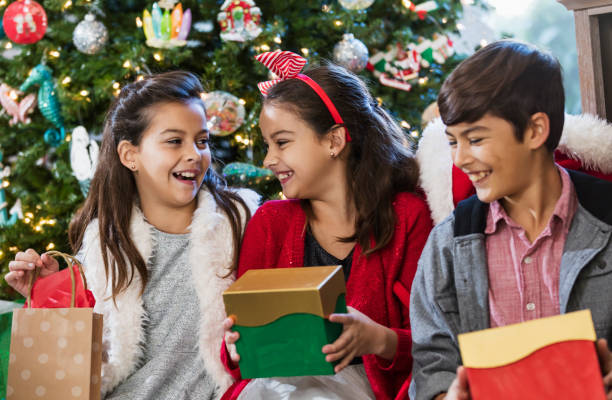istock Children opening Christmas gifts 1336010456