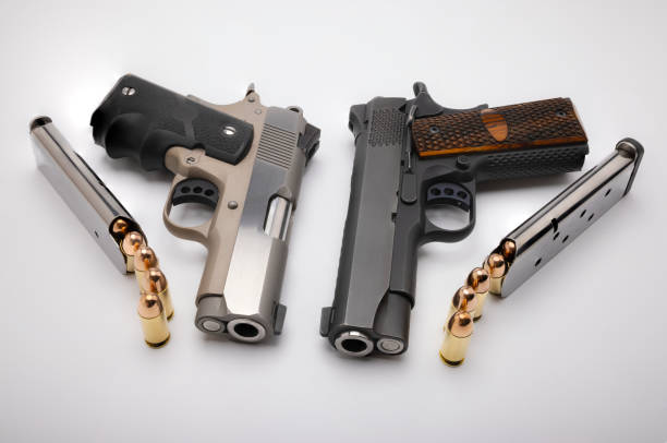 istock .45 Semi automatic hand gun with bullet magazine on white background 1336011213