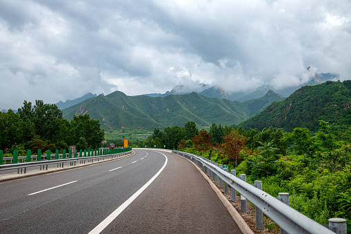 Asphalt road and beautiful mountains with clouds sea nature landscape