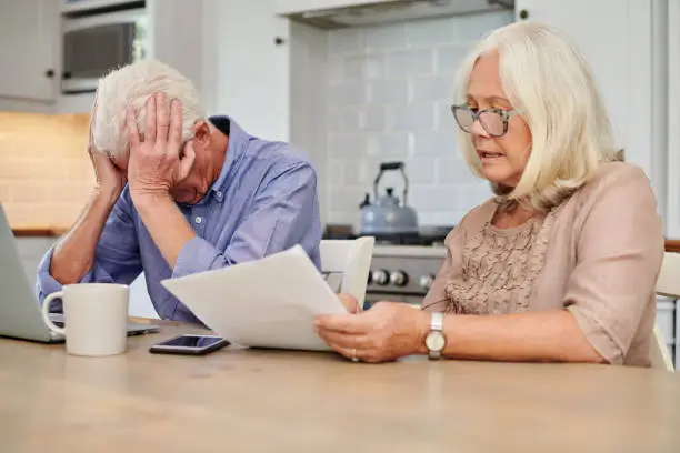 challenging a texas estate plan in probate court can be complex and emotionally charged, particularly when disputes arise between beneficiaries or third parties who believe they have been wronged, shot of a senior couple looking unhappy while going through paperwork at home