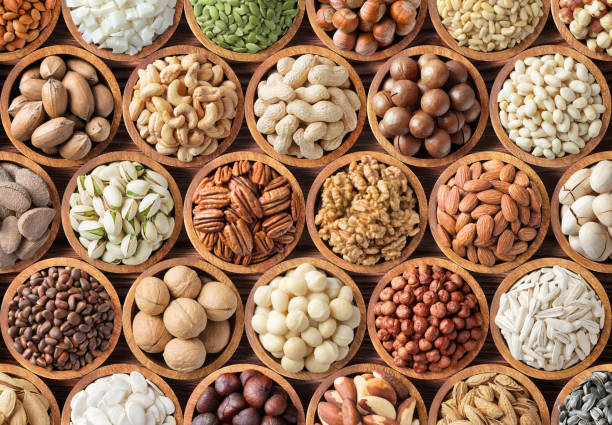 istock various nuts background, raw food in bowls, top view 1336020992