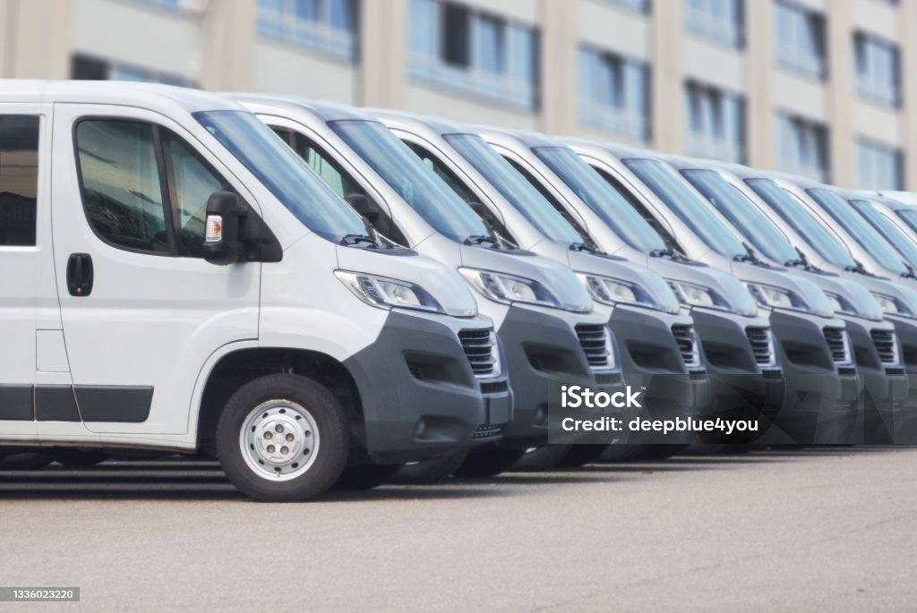 White delivery vans in a row Express Delivery Shipping Service Concept Van - Vehicle Stock Photo