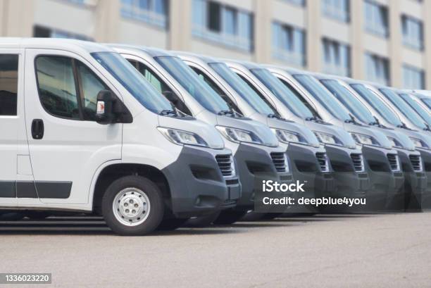White Delivery Vans In A Row Stock Photo - Download Image Now - Van - Vehicle, Fleet of Vehicles, Mini Van