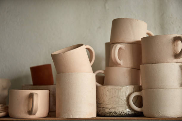 istock Pottery studio The process of creating pottery. The master ceramist works in her studio. workplace of potter 1336028983