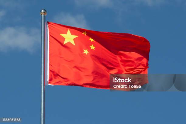 China Flag Waving In The Wind Stock Photo - Download Image Now - Chinese Flag, Chinese Culture, Politics