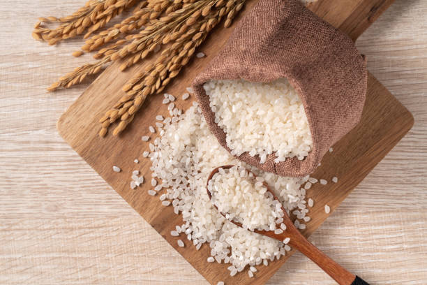 istock White rice in a bowl on wooden table background. 1336034532