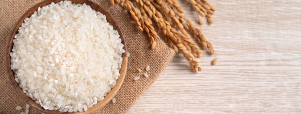 istock White rice in a bowl on wooden table background. 1336034603