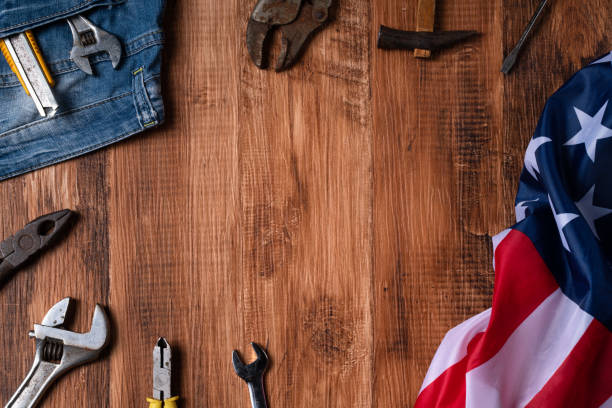 istock Top view design concept of Labor Day with working tools and jeans. 1336034737
