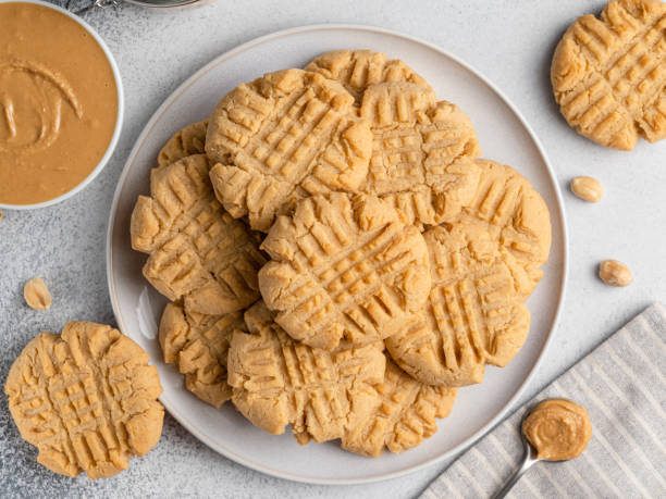 istock Peanut butter cookies on ceramic plate. Table top view. 1336039511