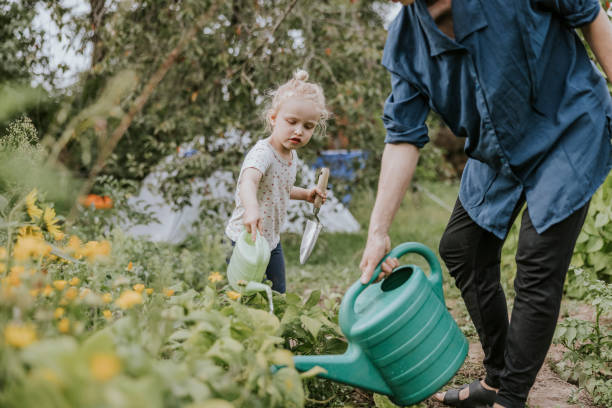 istock Young mother and child doing garden chores 1336046055
