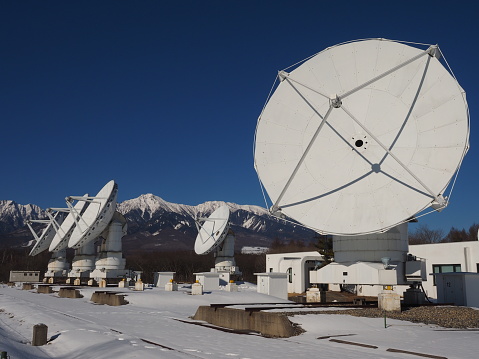 Radio telescope against a blue sky in Nobeyama, Nagano, Japan.