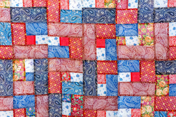 istock The patchwork bedspread is made of multi-colored pieces of fabric. 1336049355