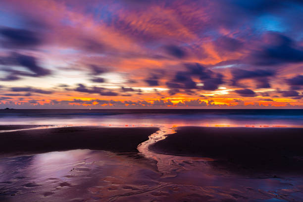 istock Twilight scene of asian beach with flowing water and clouds. 1336049497
