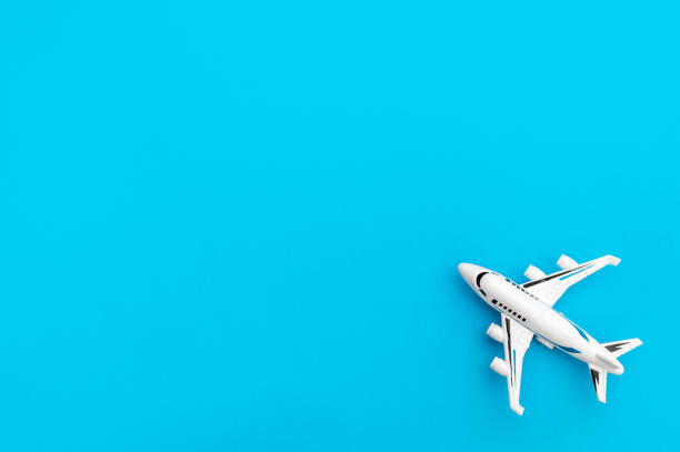 istock Airplane toy on blue background. Top view. Space for text. 1336049506