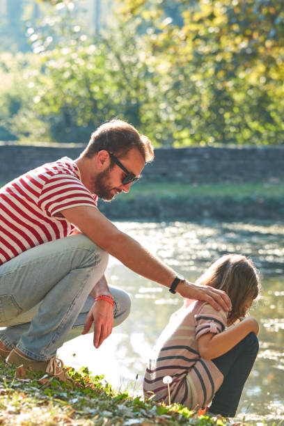 Daughter and father enjoying outdoors nature.
