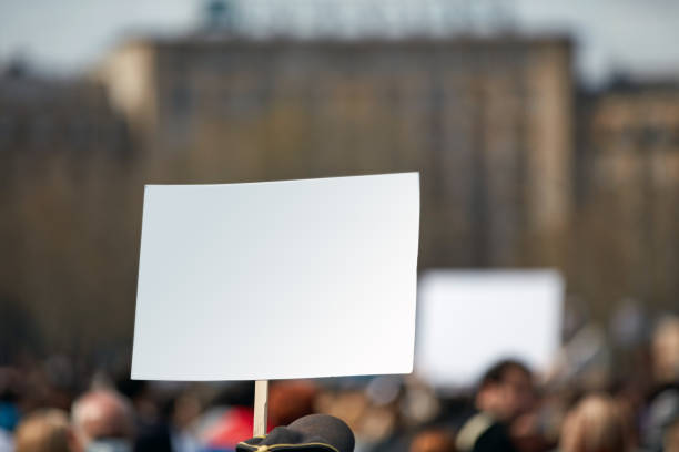 istock Protesters holding placards and signs on the streets. 1336051649
