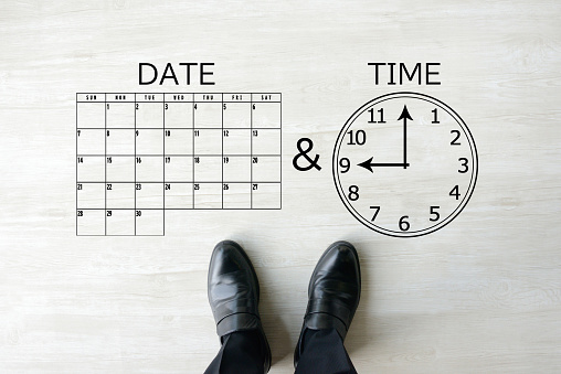 Calendar and clock clipping art and business man's shoes