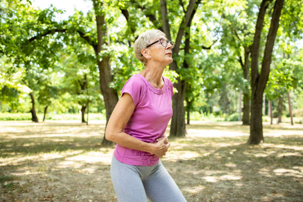 istock Senior caucasian woman having stomachache during running training. 1336055497