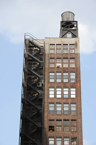 New York brownstone with fire escape and water tank on roof