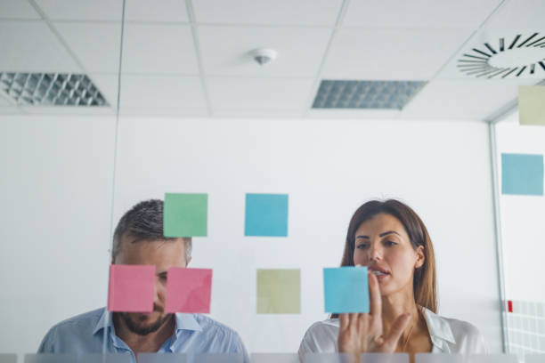 istock Team of two planning project on sticky papers 1336055887