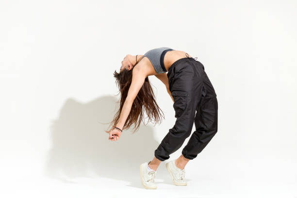 istock Agile supple young woman doing a modern hip hop dance pose 1336056883