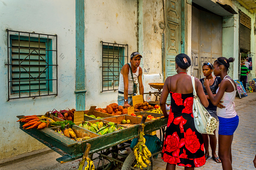Havana, Cuba - 20 April 2014: Street Hawker selling fruits and vegetables on the street.