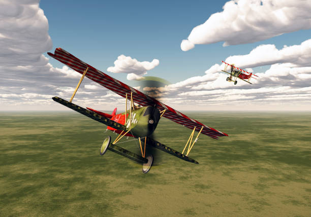 Vintage single engine propeller biplane aircraft flying against sky - bottom view