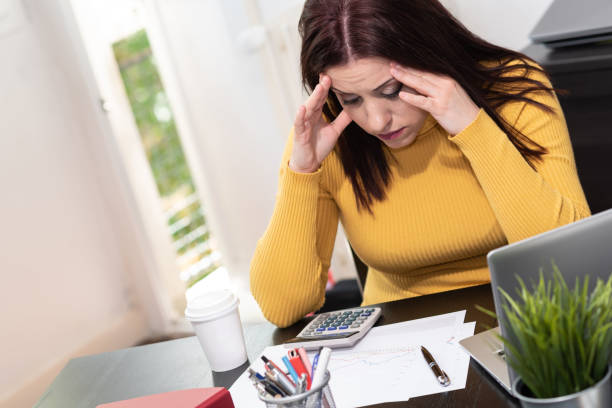 istock Desperate businesswoman with hand on forehead 1336061216
