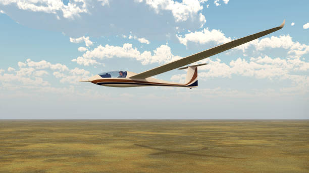 Glider over a landscape Computer generated 3D illustration with a glider over a landscape gliding stock pictures, royalty-free photos & images